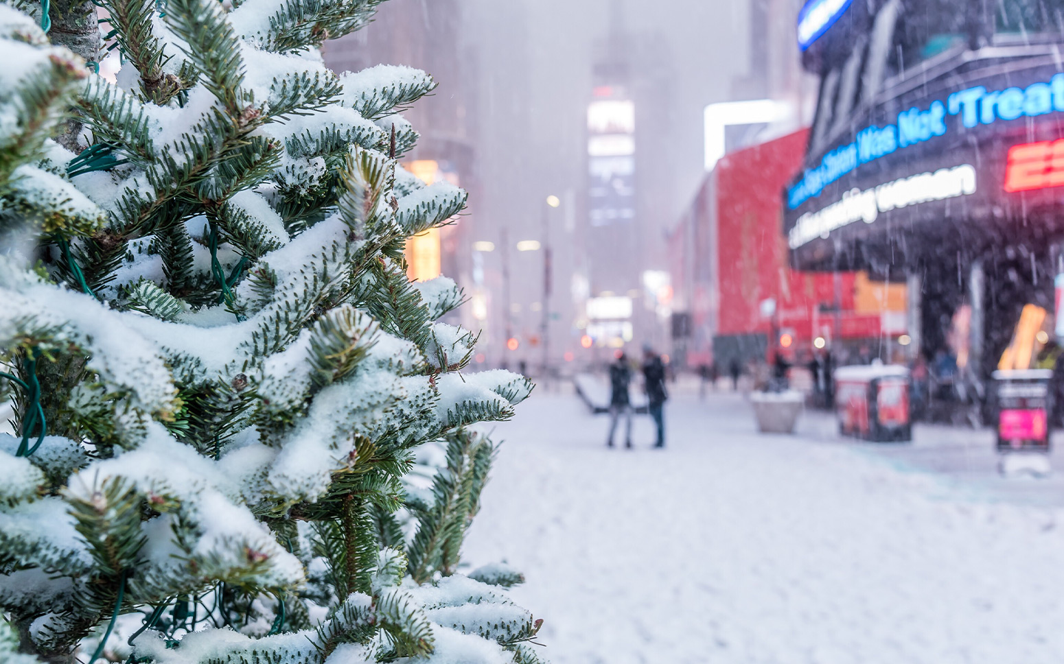 Holiday customers walk snowy streets.