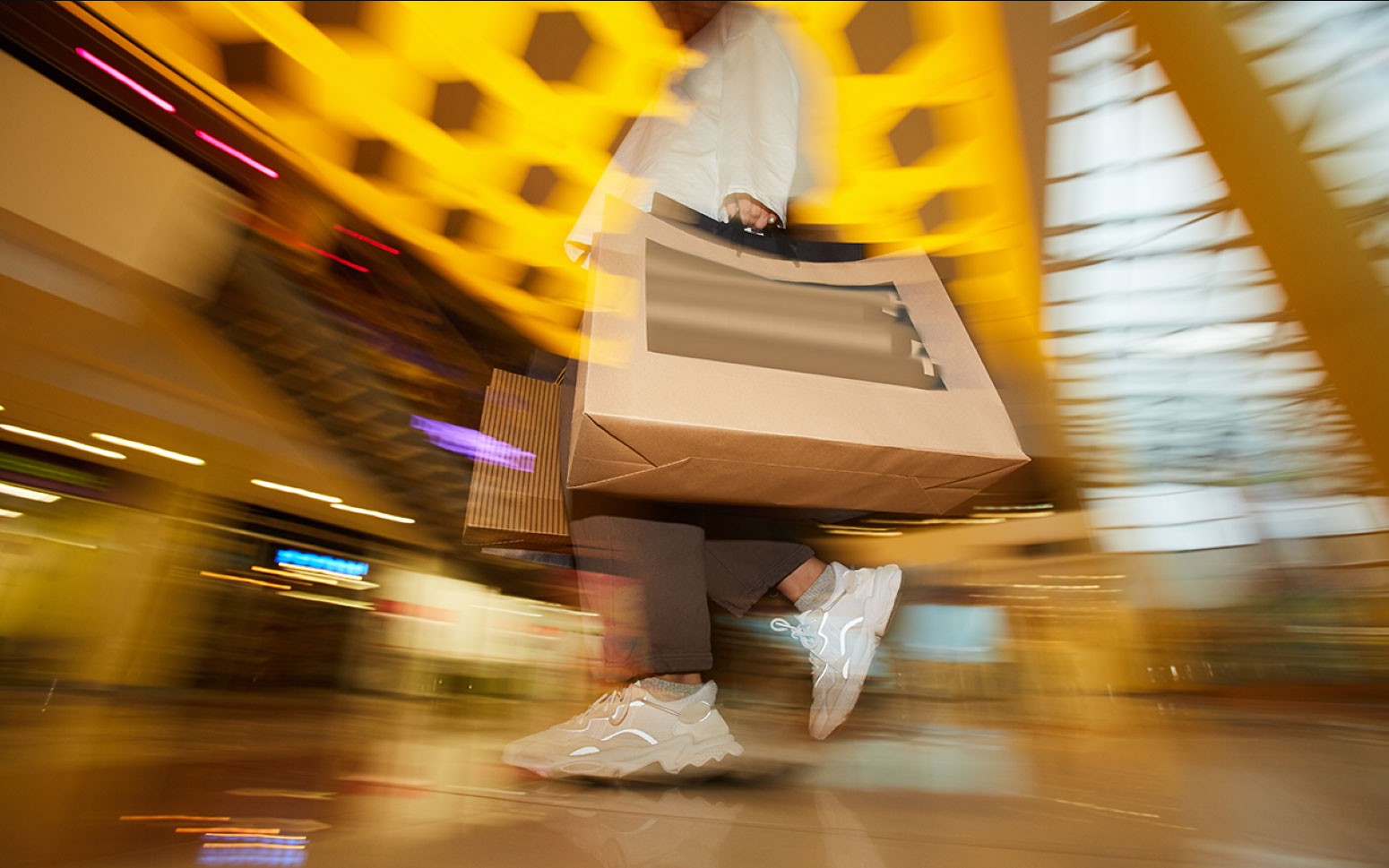 Shopper in abstract mall represents the sourcing and buying process. 